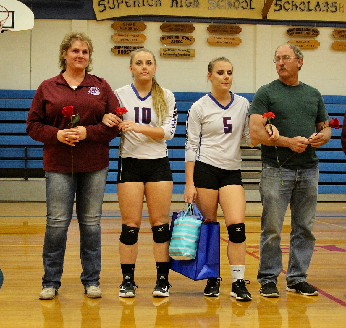 Superior sisters Kathryn (#5) and Margaret (#10) Parkin were escorted by their parents, Michelle and Richard during Senior Night last week. (Photo courtesy of Frankie Kelly)