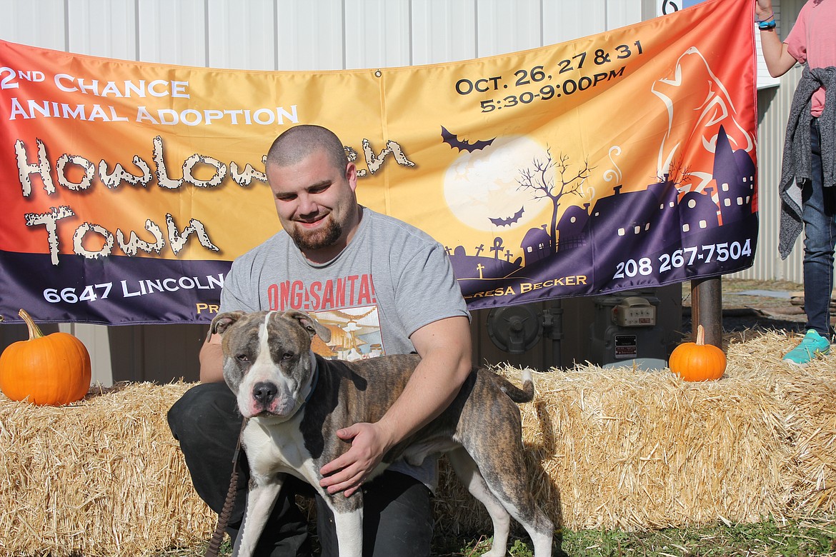 Photo by TANNA YEOUMANS
The proceeds go back to the animals. This is Tyler Coleman with Ash, who is a sweet dog in need of a forever home.