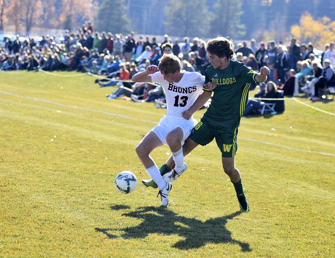 Whitefish&#146;s Xander Burger fights for control of the ball over Frenchtown&#146;s Josh Oman during the first half of the semifinal playoff game Saturday at Smith Fields. (Heidi Desch/Whitefish Pilot)