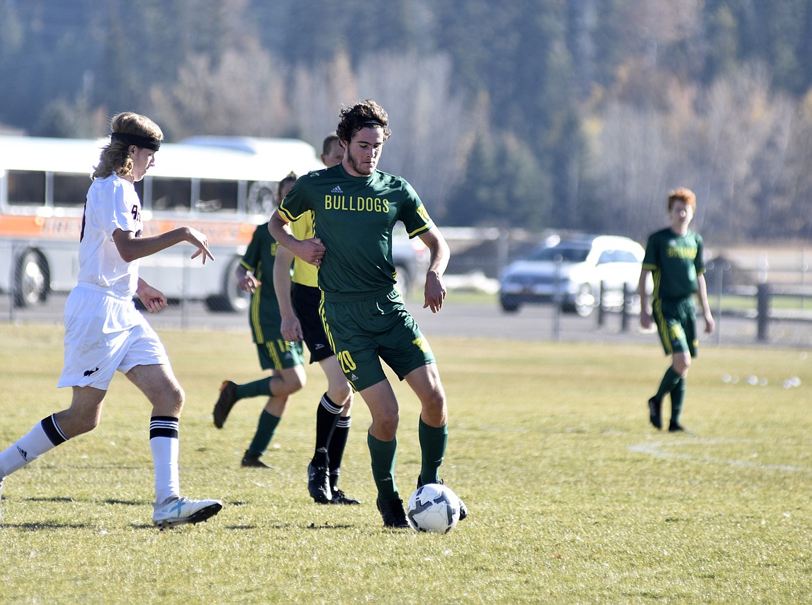 Bulldog Sam Menicke moves around a Frenchtown the semifinal playoff game Saturday at Smith Fields. (Heidi Desch/Whitefish Pilot)