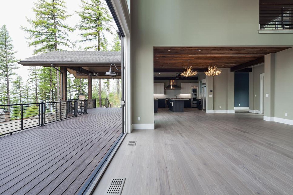 Kitchen view and outdoor back deck space separated by accordion doors in the 2019 HGTV Dream Home located on Big Mountain in Whitefish.//photo provided by HGTV