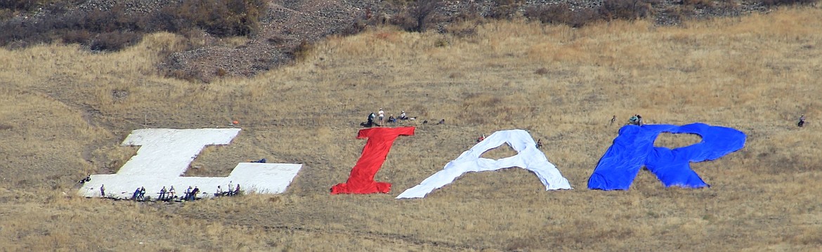 Trump protesters created a giant &#147;LIAR&#148; sign on Mount Jumbo east of Missoula out of the &#147;L&#148; on Oct. 18 when President Trump arrived to campaign for Matt Rosendale. (Kathleen Woodford/Mineral Indepedent)