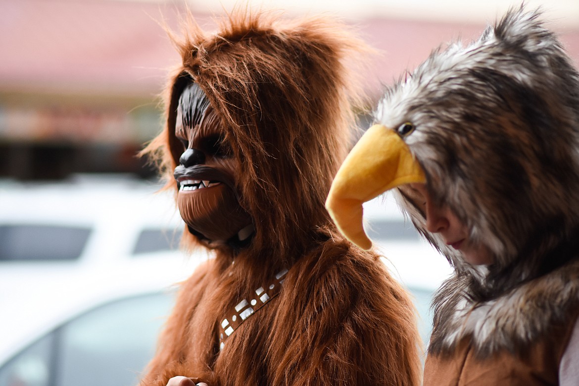 Chewbacca and an eagle roam the streets in downtown Whitefish during Halloween Wednesday. (Daniel McKay/Whitefish Pilot)