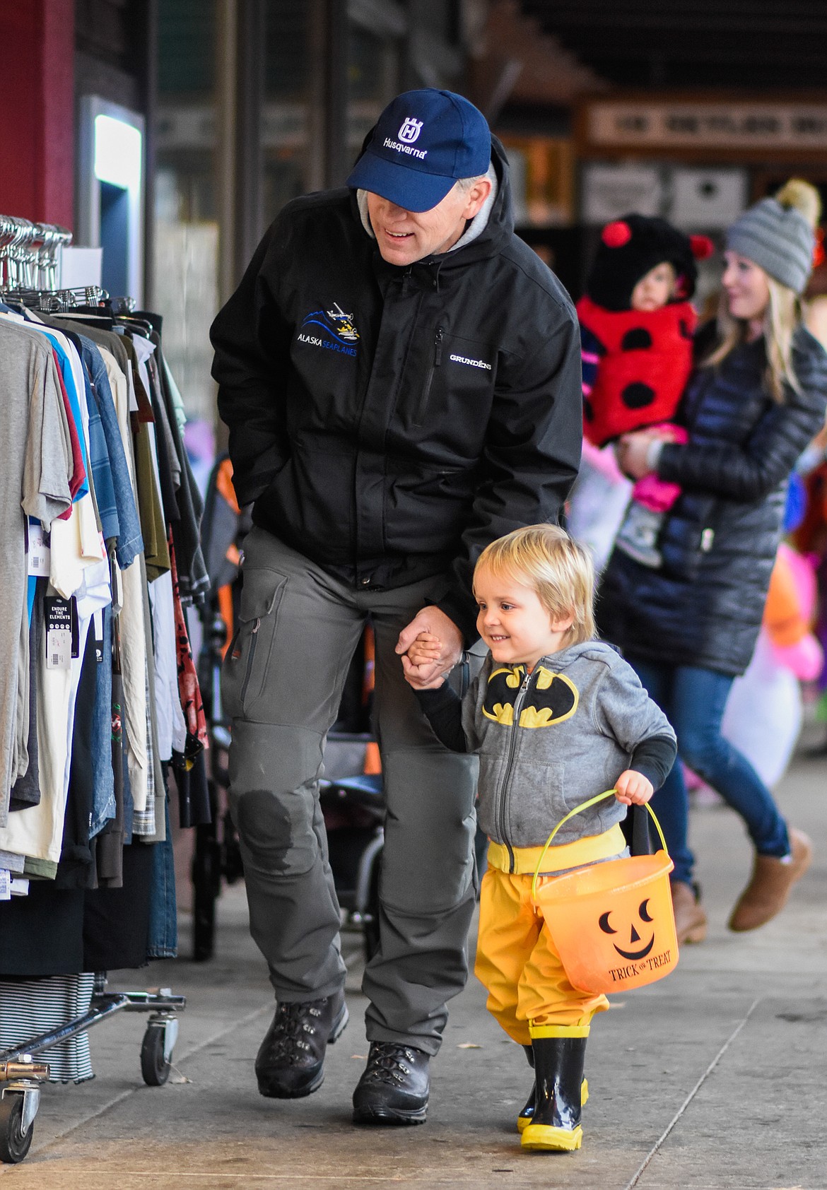 Batman smiles as he looks for candy in downtown Whitefish during Halloween Wednesday. (Daniel McKay/Whitefish Pilot)