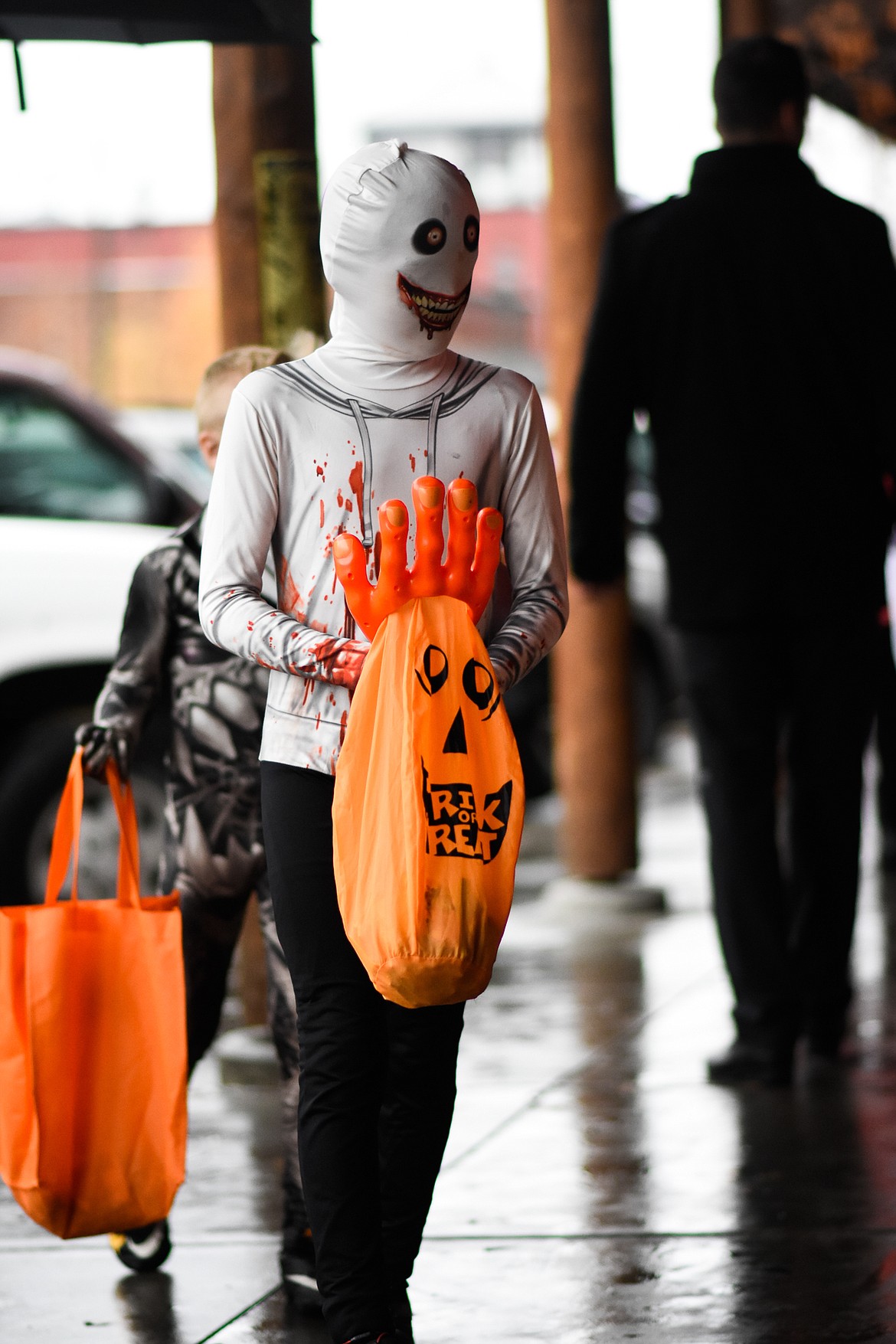 A scary-looking youngster searches for treats in downtown Whitefish during Halloween Wednesday. (Daniel McKay/Whitefish Pilot)