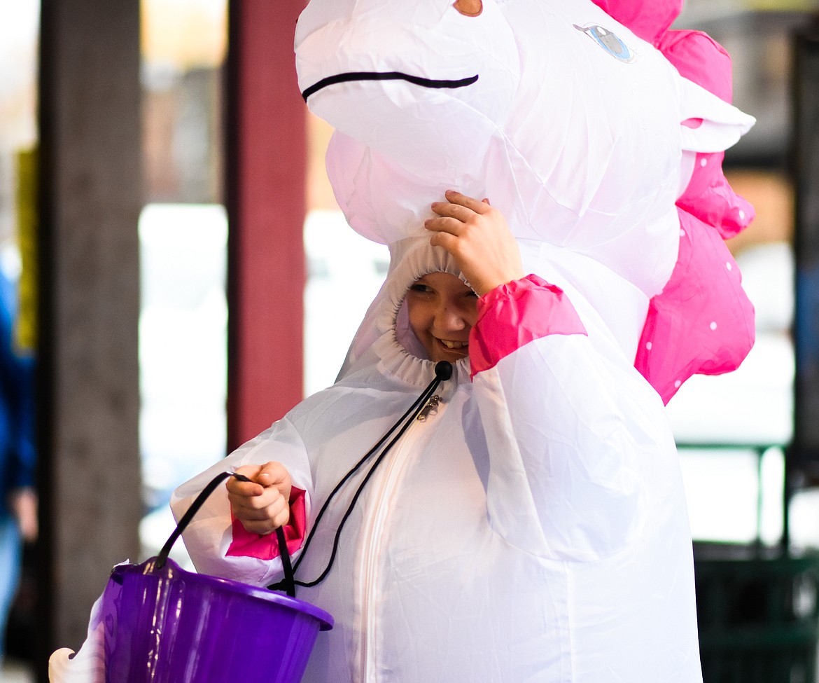 A unicorn smiles in downtown Whitefish during Halloween Wednesday. (Daniel McKay/Whitefish Pilot)