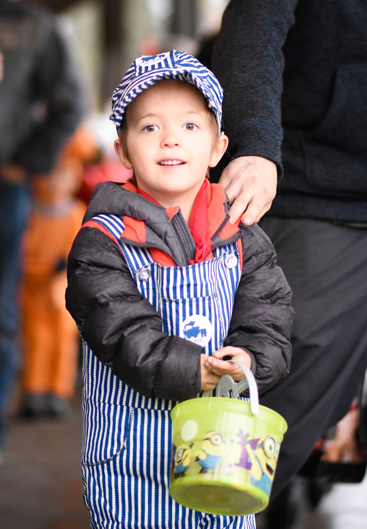 A train conductor takes a break from the BNSF Railroad to look for candy in downtown Whitefish during Halloween Wednesday. (Daniel McKay/Whitefish Pilot)