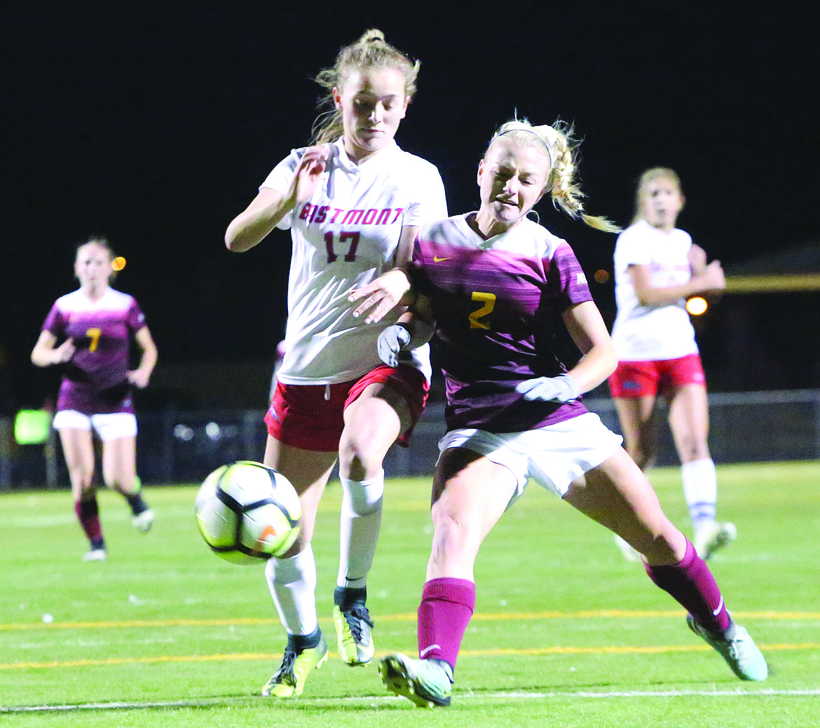 Connor Vanderweyst/Columbia Basin Herald
Moses Lake forward Madi Krogh (2) tries to get a shot off next to Eastmont defender Tess Sparks.