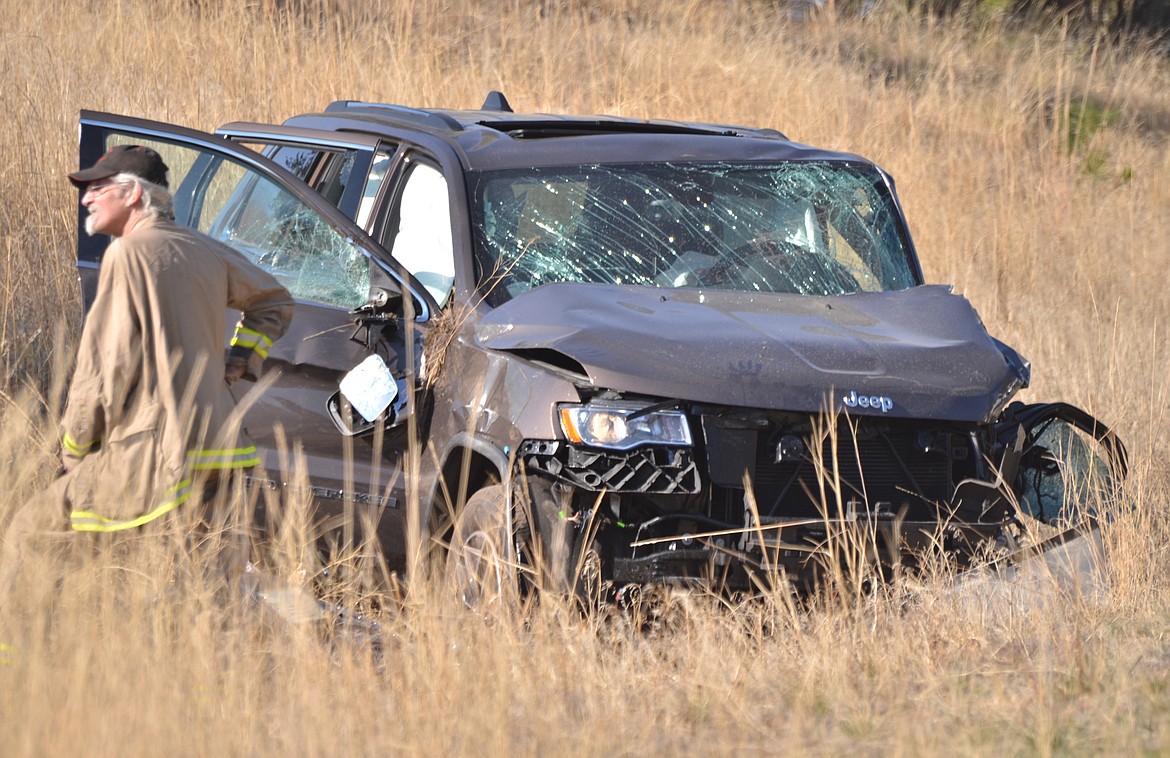 The Jeep Grand Cherokee involved in a head-on collision on Montana 200 the afternoon of Monday, Oct. 22 wound up in the barrow pit. The occupants of both vehicles were all wearing their seat belt and did not suffer life-threatening injuries, according to law enforcement officials. (Erin Jusseaume photos/Clark Fork Valley Press)