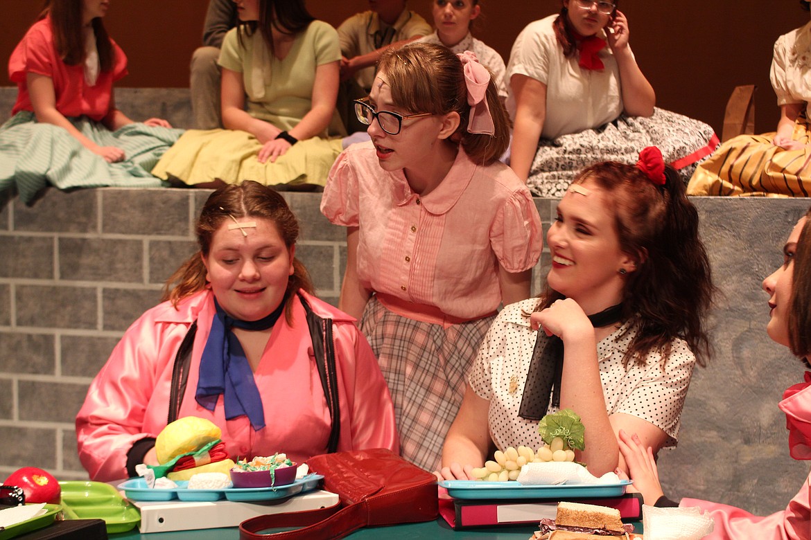 Cheryl Schweizer/Columbia Basin Herald

Sandy (Karlye Shank, standing) learns some shocking information in the Moses Lake High School production of &#145;Grease,&#146; opening Thursday.