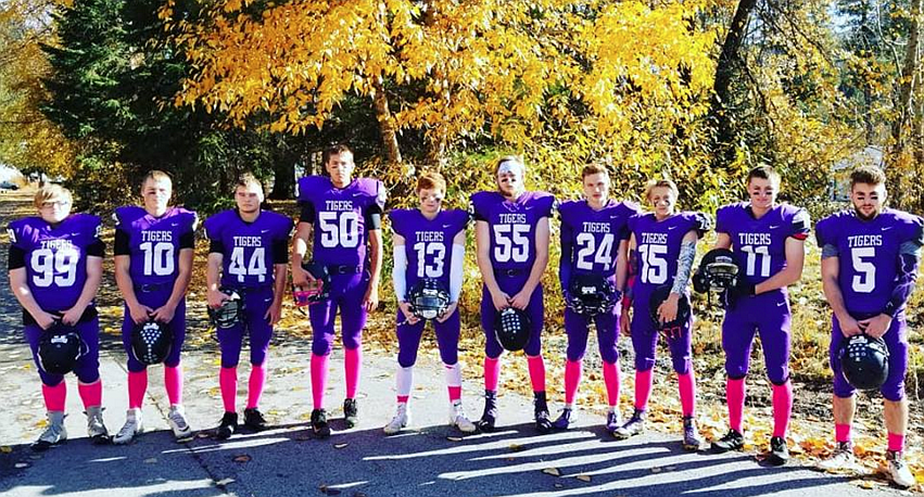 Courtesy photo
The Mullan Tigers, rocking pink socks for the month of October, grabbed a quick team picture Friday before dominating their final game of the season, a 62-26 win over visiting Lewis County.