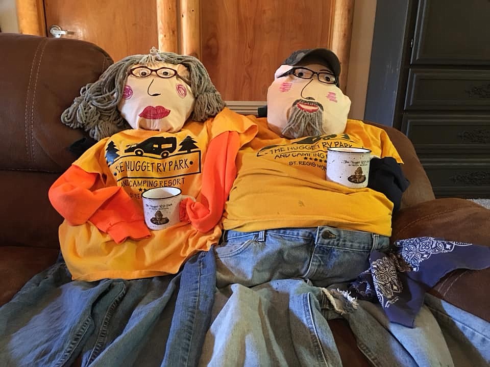 Prior to the St. Regis annual Scarecrow Contest on Oct. 27, the Gold Nugget RV Park Scare Crow entries relax with a cup of coffee. The pair won third place, created by Mark and Leslie Leenhouts. (Photo courtesy of Mark and Leslie Lennouts)