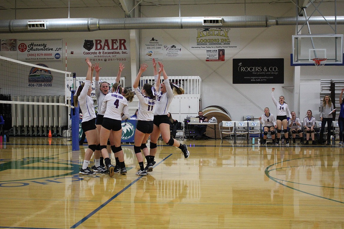 Lady Mountain Cats cheer after they beat Valley Christian and moved on to the championship match against Seeley-Swan during the District 13C Tournament in Missoula on Oct. 27.