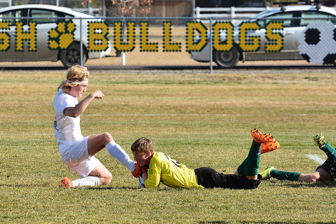 Whitefish goal keeper Colter Upton earns a diving save against Polson Saturday at Smith Fields. (Photo courtesy Jeff Doorn)