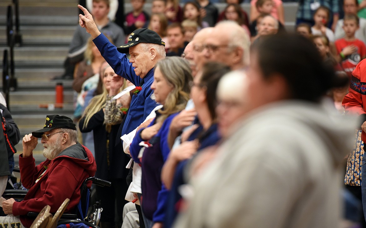 A veterans stands and sings along with the Star Spangled Banner at the start of the Veterans Day Assembly on Friday, November 9.(Brenda Ahearn/Daily Inter Lake)