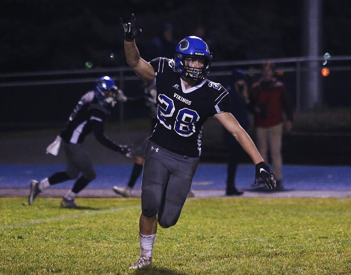 Coeur d&#146;Alene&#146;s Brennan Crawford celebrates the Vikings&#146; 37-34 state 5A football quarterfinal win over Borah.