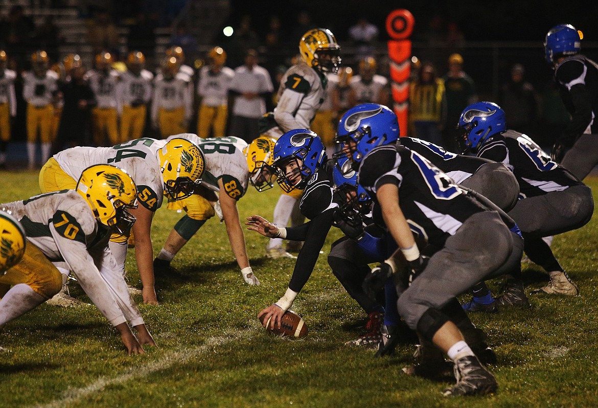 Coeur d&#146;Alene&#146;s Nick Pierce pauses before snapping the ball against Borah on Friday night.