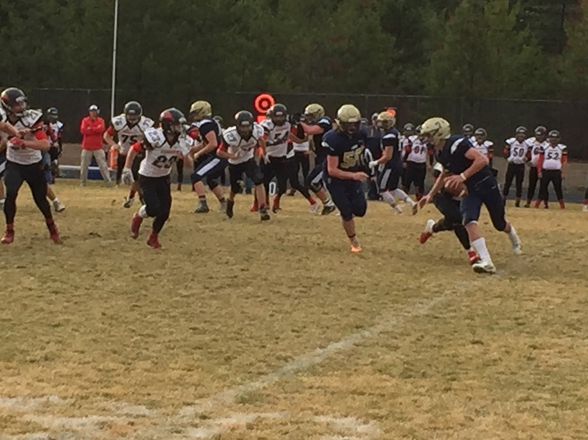 MARK NELKE/Press
Timberlake quarterback Joey Follini rolls out against South Fremont.