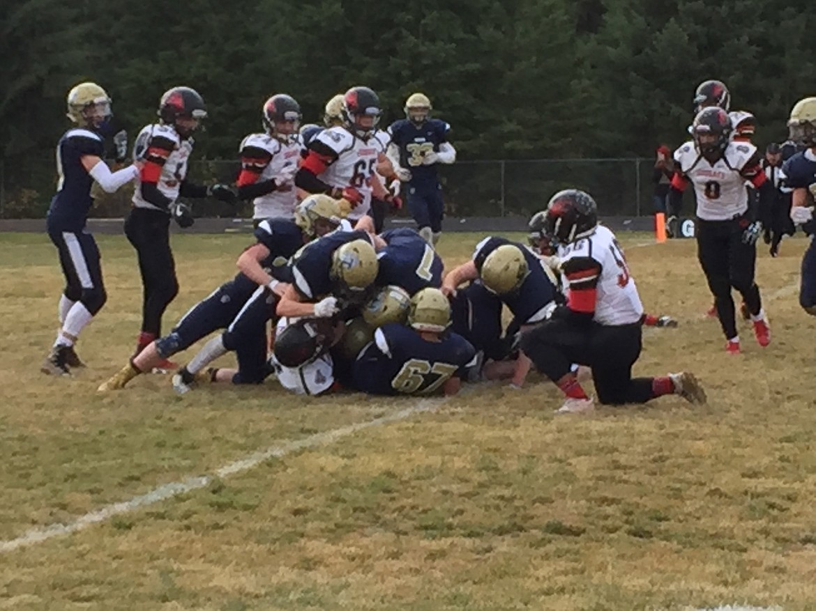 MARK NELKE/Press
Timberlake's defense gang-tackles South Fremont quarterback Jace Neville in the second half.