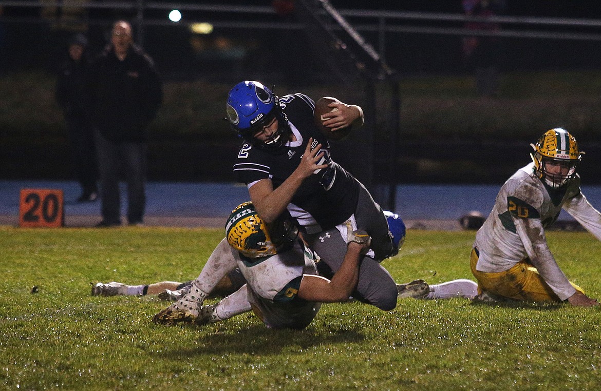 LOREN BENOIT/Press
Coeur d&#146;Alene&#146;s Carter Friesz gathers a tipped pass for a long completion that led to a Viking score in Friday&#146;s  state 5A football quarterfinal game against Borah on Friday night at Viking Field.