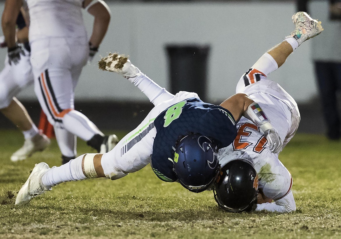 DARIN OSWALD/Idaho Statesman
Mountain View linebacker Dylan Martinez plants Post Falls running back Tommy Hauser into the turf for a big loss in the state 5A football quarterfinals on Friday in Meridian.