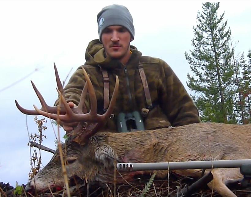 Photo courtesy of Slick Log Productions
A hunter poses with a North Idaho whitetail deer harvested in 2015.