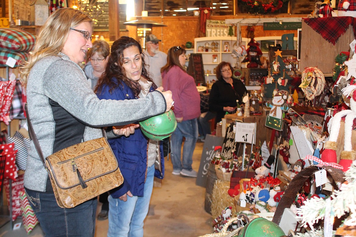 Cheryl Schweizer/Columbia Basin Herald

Giant Christmas bells were among the items of interest at the annual Piper Barn show.