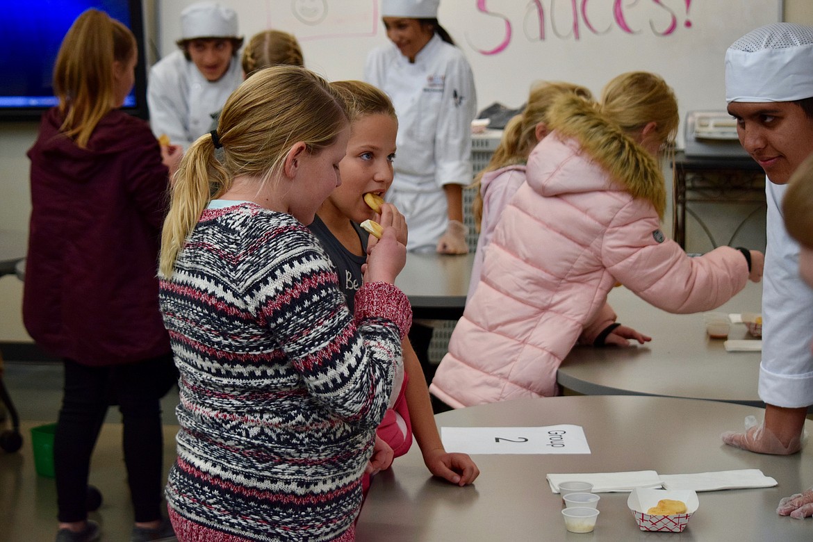 Charles H. Featherstone/Columbia Basin Herald
Fifth-graders taste sauces and potato snacks at CB Tech on Wednesday as part of &#147;Potato Days,&#148; sponsored by the Washington State Potato Commission.