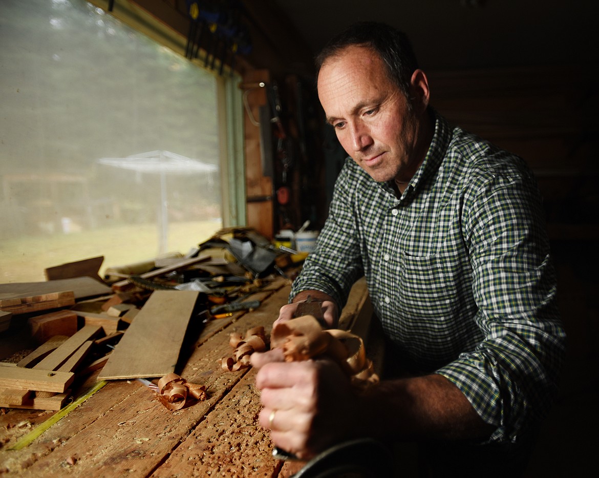 Steve Morley demonstrates planing an oar in the workshop in Swan Lake on Tuesday, October 30.
(Brenda Ahearn/Daily Inter Lake)