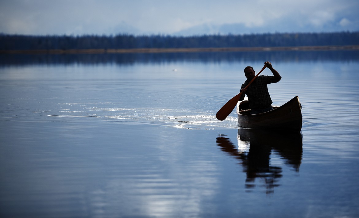 Steve Morley in a newly made canoe out on Swan Lake on Tuesday, October 30.(Brenda Ahearn/Daily Inter Lake)