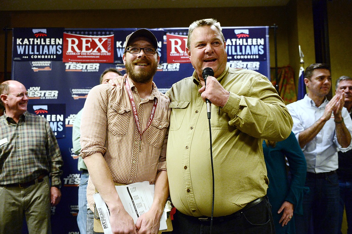 Sen. Jon Tester speaks on stage with Joey Shelley, an organizer with the Montana Democratic Party, at a Get Out the Vote rally at the Red Lion Hotel in Kalispell on Saturday. (Casey Kreider/Daily Inter Lake)