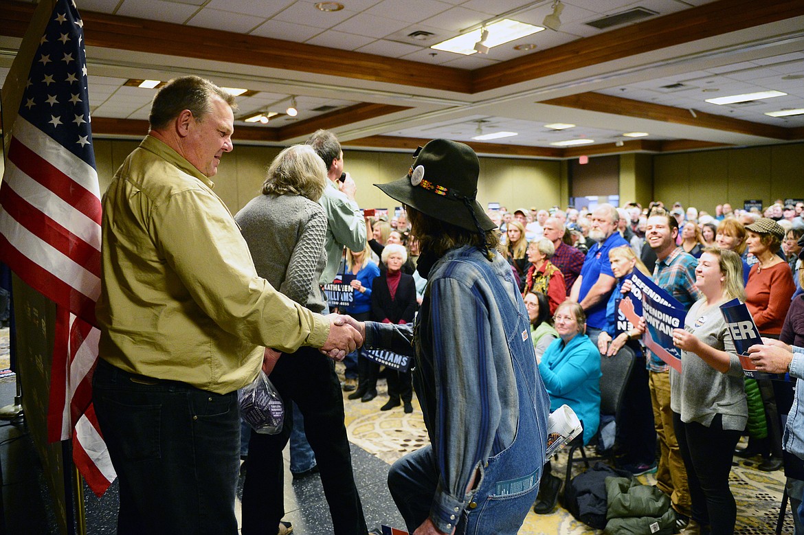 Sen. Jon Tester greets Robert Petersen, Democratic candidate for House District 9, at a Get Out the Vote rally at the Red Lion Hotel in Kalispell on Saturday. (Casey Kreider/Daily Inter Lake)