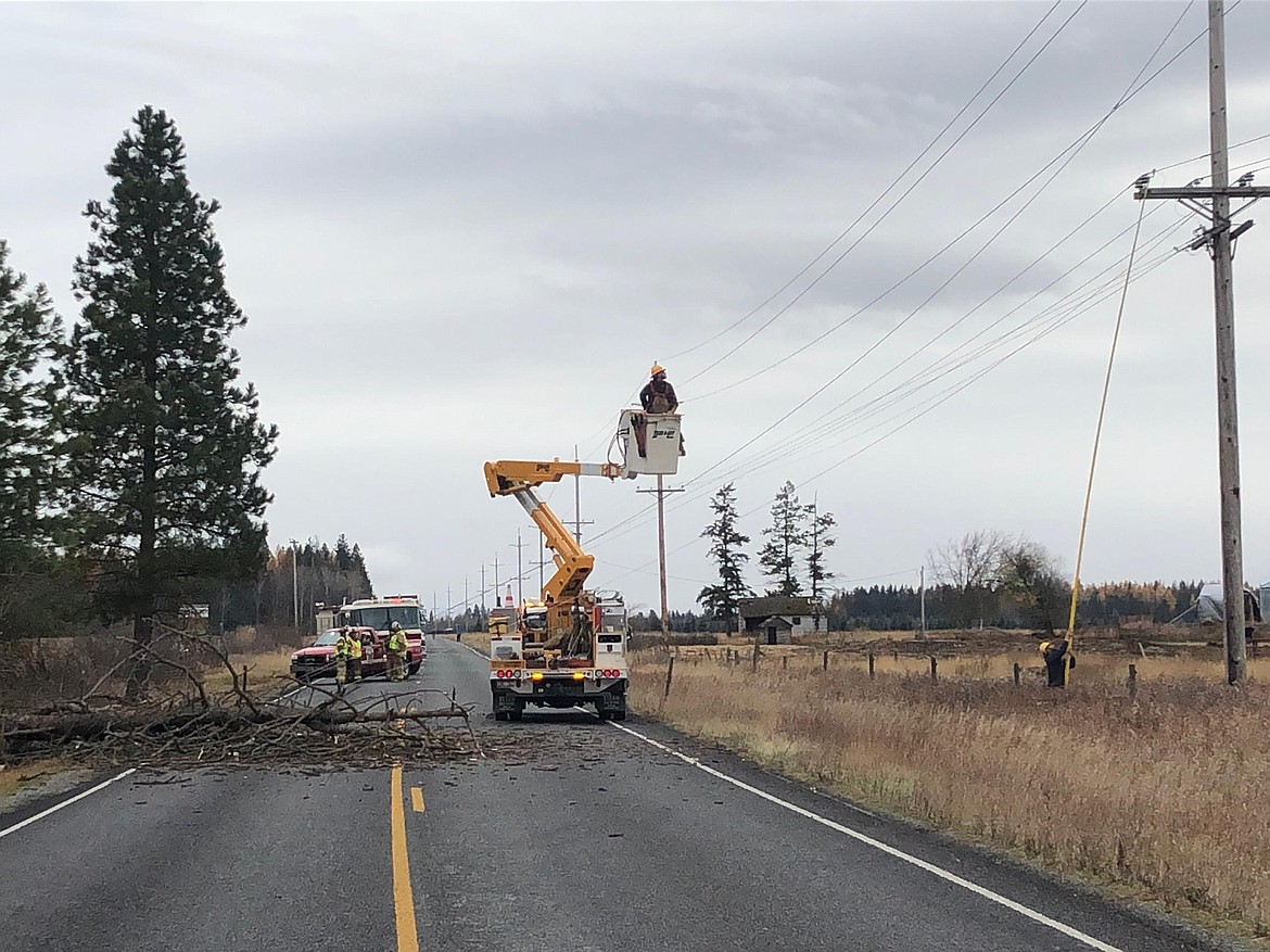 Courtesy photo
Wind downed a tree that took out power lines around 10 a.m. on Oct. 31. The power lines and tree blocked U.S. 95 at milepost 518 and closed the highway for an hour until Northern Lights was able to repair the situation. Also responding were North Bench Fire, Boundary County Sheriff&#146;s Office, and Bonners Ferry Police Department.