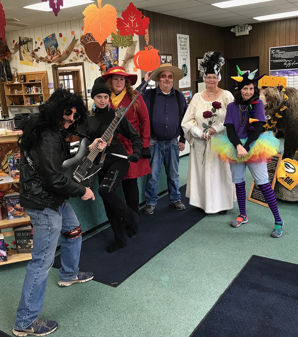 Photo by ANNE MCCLINTOCK
At the Boundary County Library, having fun on Halloween, from left: Craig Anderson as Buck Dharma from Blue &Ouml;yster Cult, Amy Maggie as a ninja, Cari Haarstick as Carmen Sandiego, Derrick Grow Tio Berto from the movie Coco, Dianna Zills as the Bride of Frankenstein, Teri Neumayer as a Rainbowsaurus.