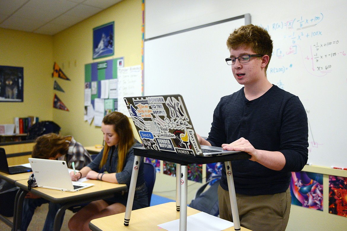 From right, Glacier High School students Simon Roston, Emma Lovejoy and Joseph Schlegel work on a policy speech during Wolfpack Speech &amp; Debate Team practice at the school on Oct. 30.