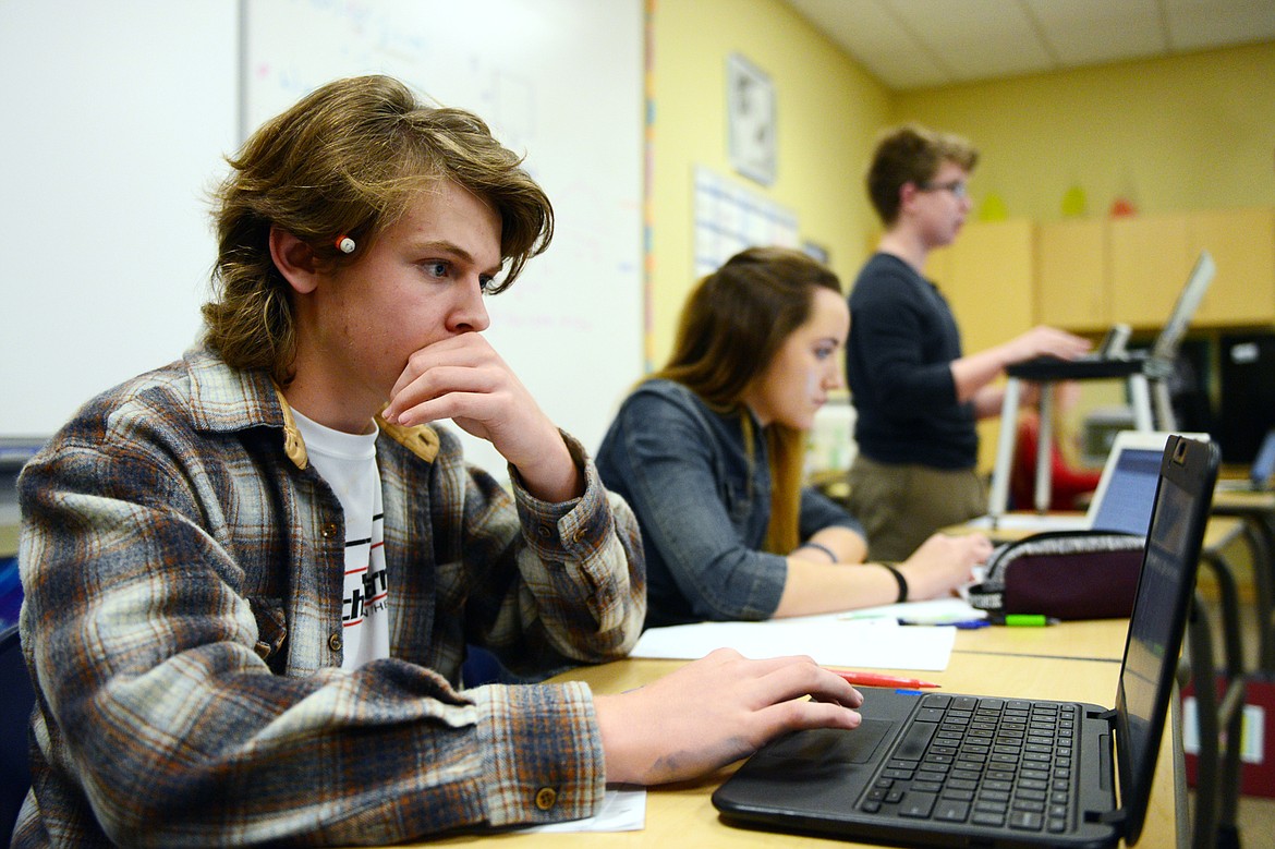 From left, Glacier High School students Joseph Schlegel, Emma Lovejoy, Simon Roston and Mercedes Santa work on a policy speech during Wolfpack Speech &amp; Debate Team practice at the school on Tuesday, Oct. 30. (Casey Kreider/Daily Inter Lake)