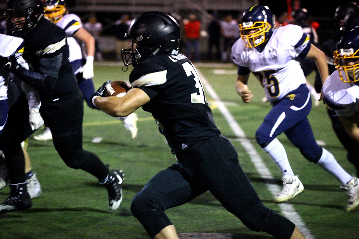 Rodney Harwood/Columbia Basin Herald
Royal senior Alonso Hernandez (34) scored all five of his rushing touchdowns in the first quarter of the Knights&#146; SCAC Crossover Playoff Game at David Nielsen Stadium.