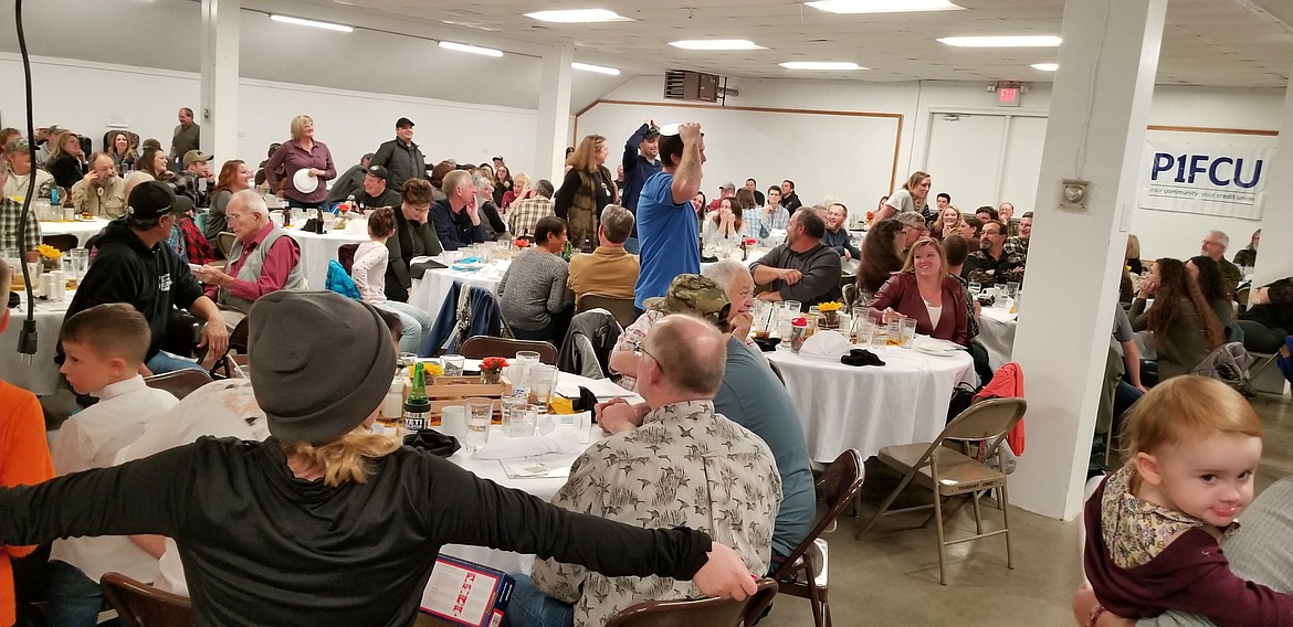 Photo by MANDI BATEMAN
The adults playing Heads or Tails where the winner took home a new grill.