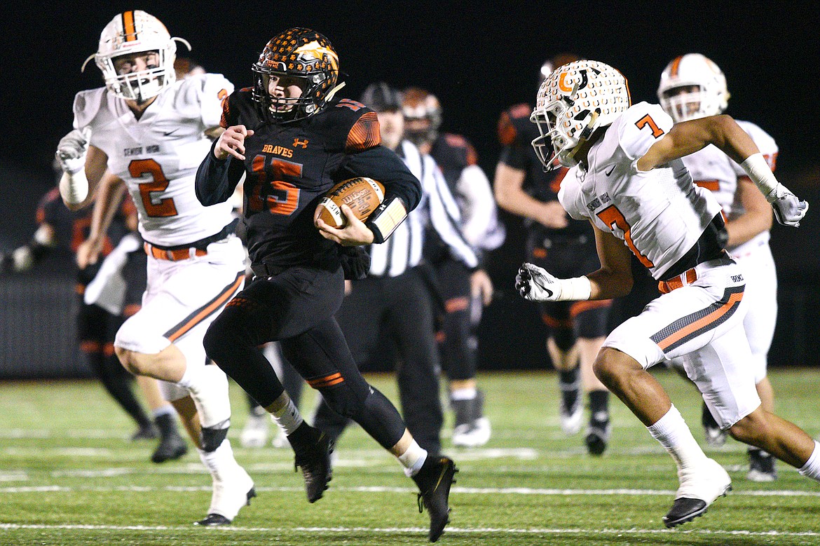 Flathead quarterback Jaden MacNeil breaks free for a 51-yard touchdown run in the first quarter against Billings Senior in a Class AA quarterfinal playoff game at Legends Stadium on Friday. (Casey Kreider/Daily Inter Lake)