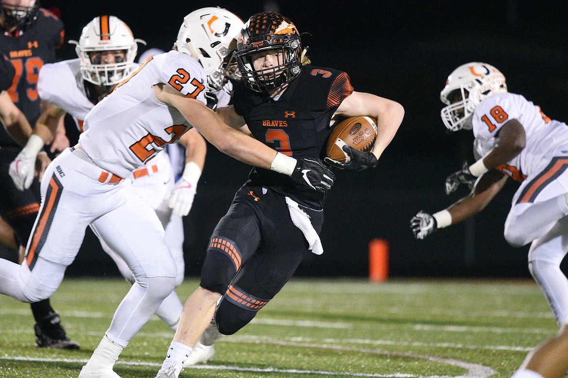 Flathead wide receiver Chance Sheldon-Allen (3) looks for room to run in the first quarter against Billings Senior in a Class AA quarterfinal playoff game at Legends Stadium on Friday. (Casey Kreider/Daily Inter Lake)