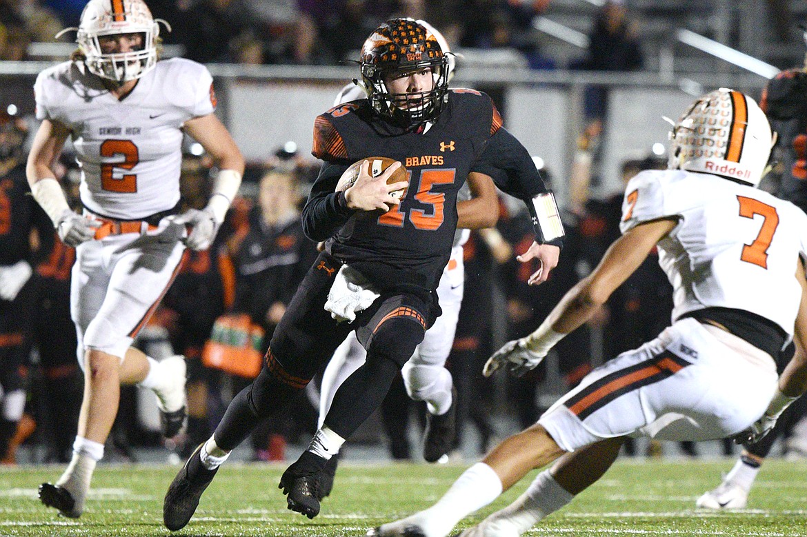 Flathead quarterback Jaden MacNeil breaks loose in the third quarter against Billings Senior in a Class AA quarterfinal playoff game at Legends Stadium on Friday. (Casey Kreider/Daily Inter Lake)