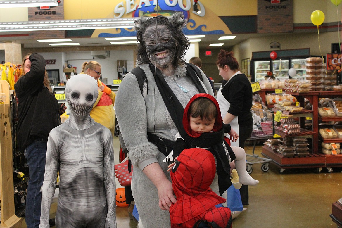 Photo by TANNA YEOUMANS
Jace Yeoumans as &#145;The Rake&#146;, Ethan Norton as Spiderman, Jaycee Norton and mom Rebecca Norton attended the Super 1 festivities.