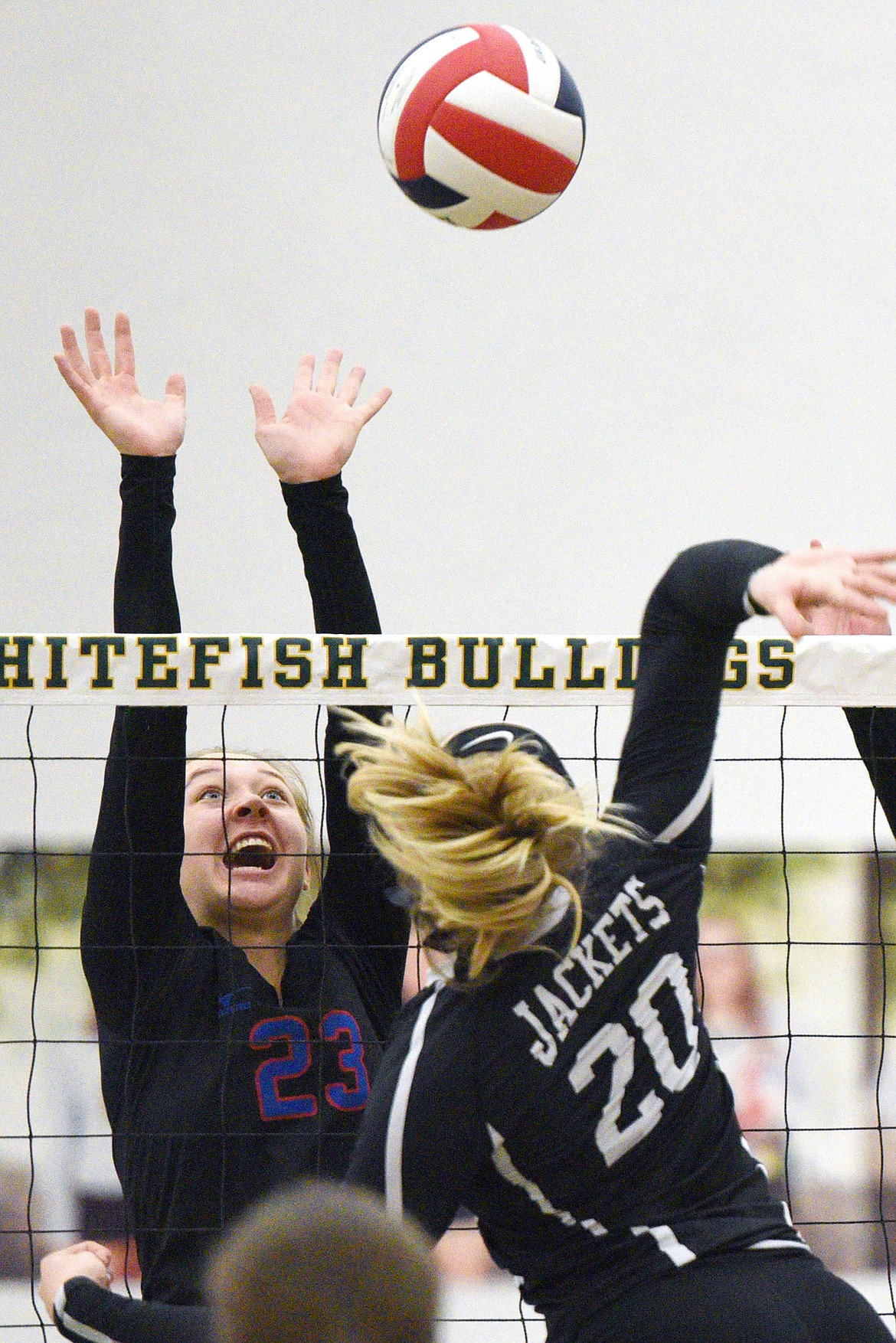 Columbia Falls' Ryley Kehr (23) goes up for a block against Stevensville's Angel Richards (20) in the Western A Divisional playoffs at Whitefish High School on Thursday. (Casey Kreider/Daily Inter Lake)