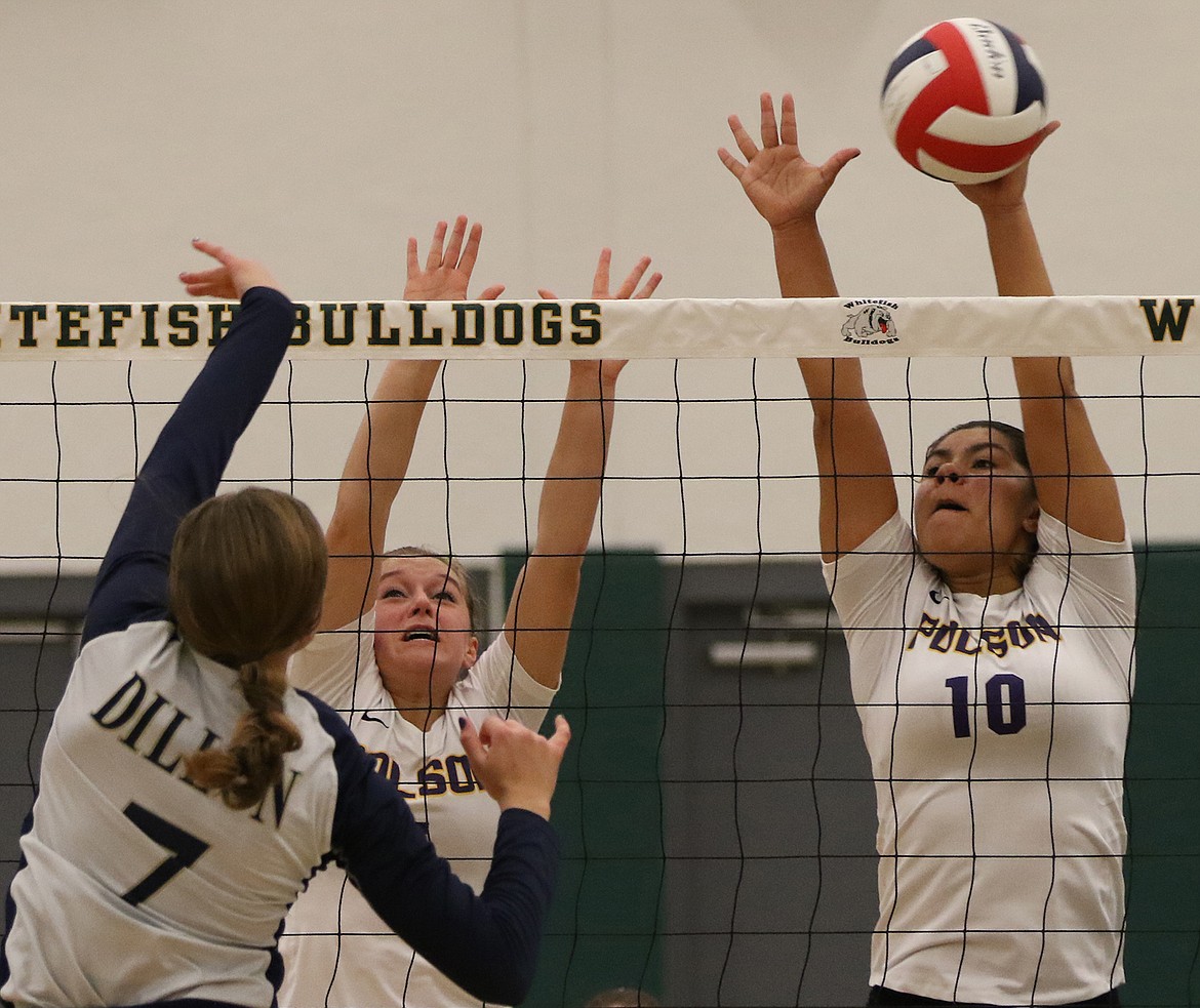 Polson&#146;s Olivia Perez (10) and Berkley Ellis, left, use a double block to reject an attack by a Dillon hitter during the Western A Divisional. The Lady Pirates won 3-2 to stay alive, but were eliminated by Columbia Falls. (Bob Gunderson/Lake County Leader)