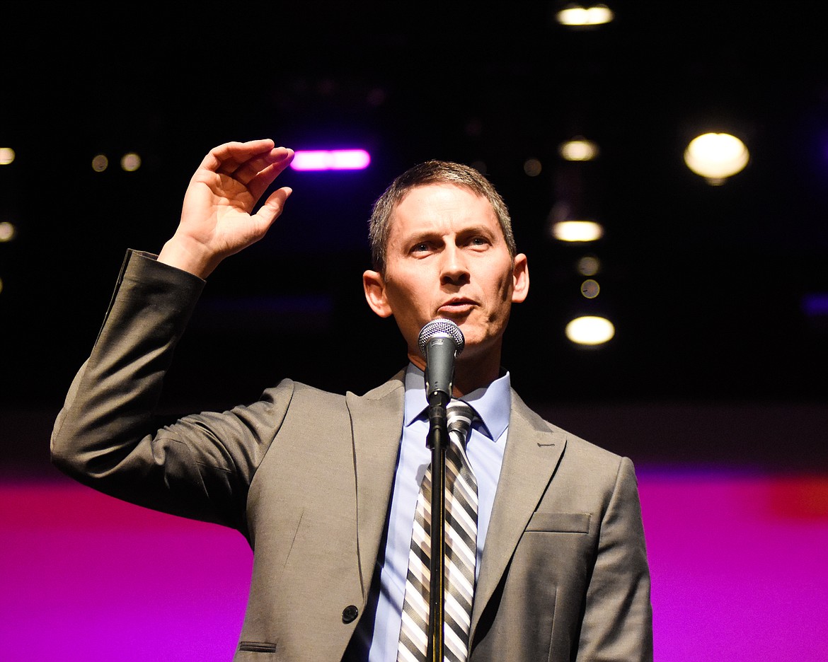 Director Mark McCrady speaks to the audience during the fall band concert last Thursday at the Performing Arts Center.