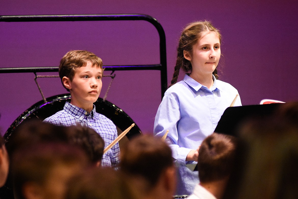 Reid Alexander and Ariana Whitcomb keep their eyes on conductor Mark McCrady during their fall concert last Thursday at the Performing Arts Center.