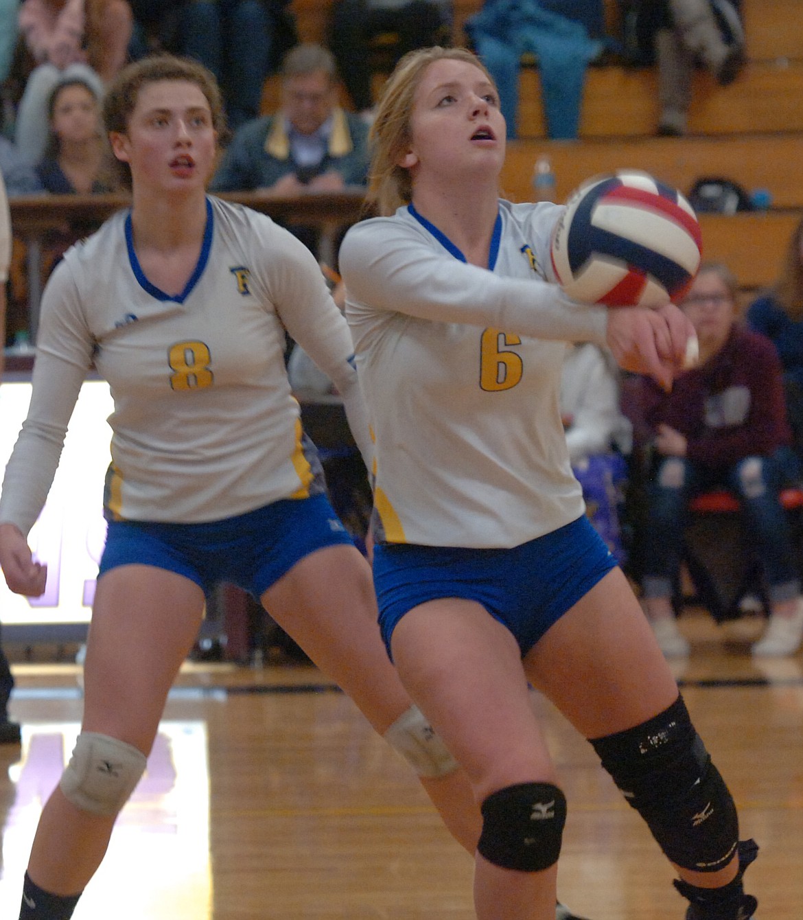 Thompson Falls sophomore Riley Wilson (6) sets up an attack during the Lady Hawks&#146; semifinal match against Florence at the Western B Divisional Tournament last Friday night in Florence. Jody Detlaff (8) is in the background. (Joe Sova/Clark Fork Valley Press)