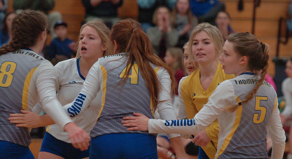 Thompson Falls teammates huddle after scoring a point against eventual champion Florence during the Western B Divisional Tournament last Friday. (Joe Sova/Clark Fork Valley Press)