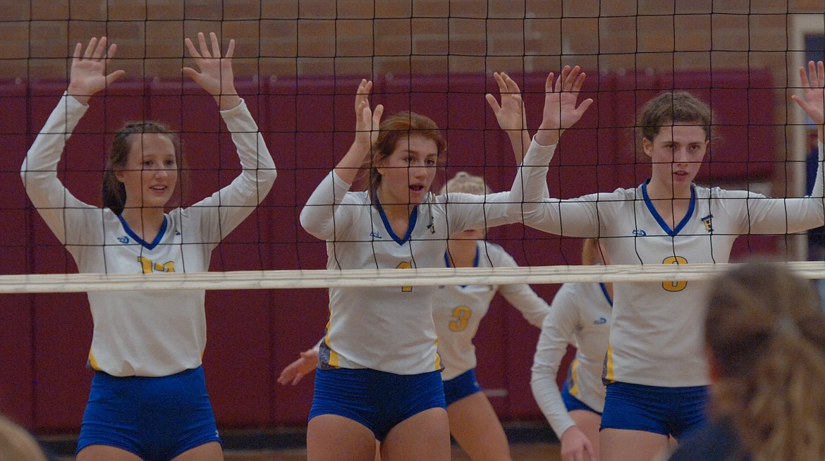 Lady Hawks front row players Ellie Pardee (12), Brooke Bowlin (4) and Jody Detlaff (8) prepare for a potential block during last Friday&#146;s Western B Divisional semifinal match against Florence. Scarlette Schwindt (3) and Riley Watson (6) are in the back row. The Lady Falcons swept Thompson Falls and beat Deer Lodge for the tourney title. (Joe Sova/Clark Fork Valley Press)