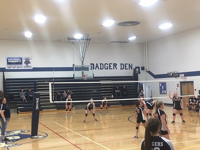 BCMS volleyball players in action.